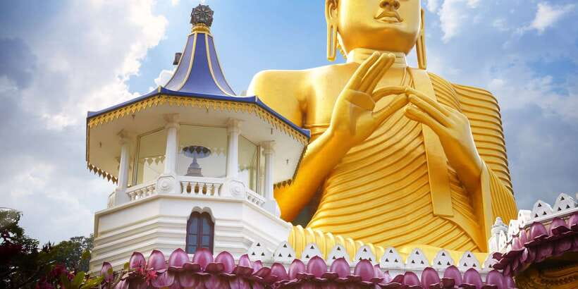 From Negombo: Sigiriya and Dambulla Day Trip and Safari - Dambulla Cave Temple before the worship closure